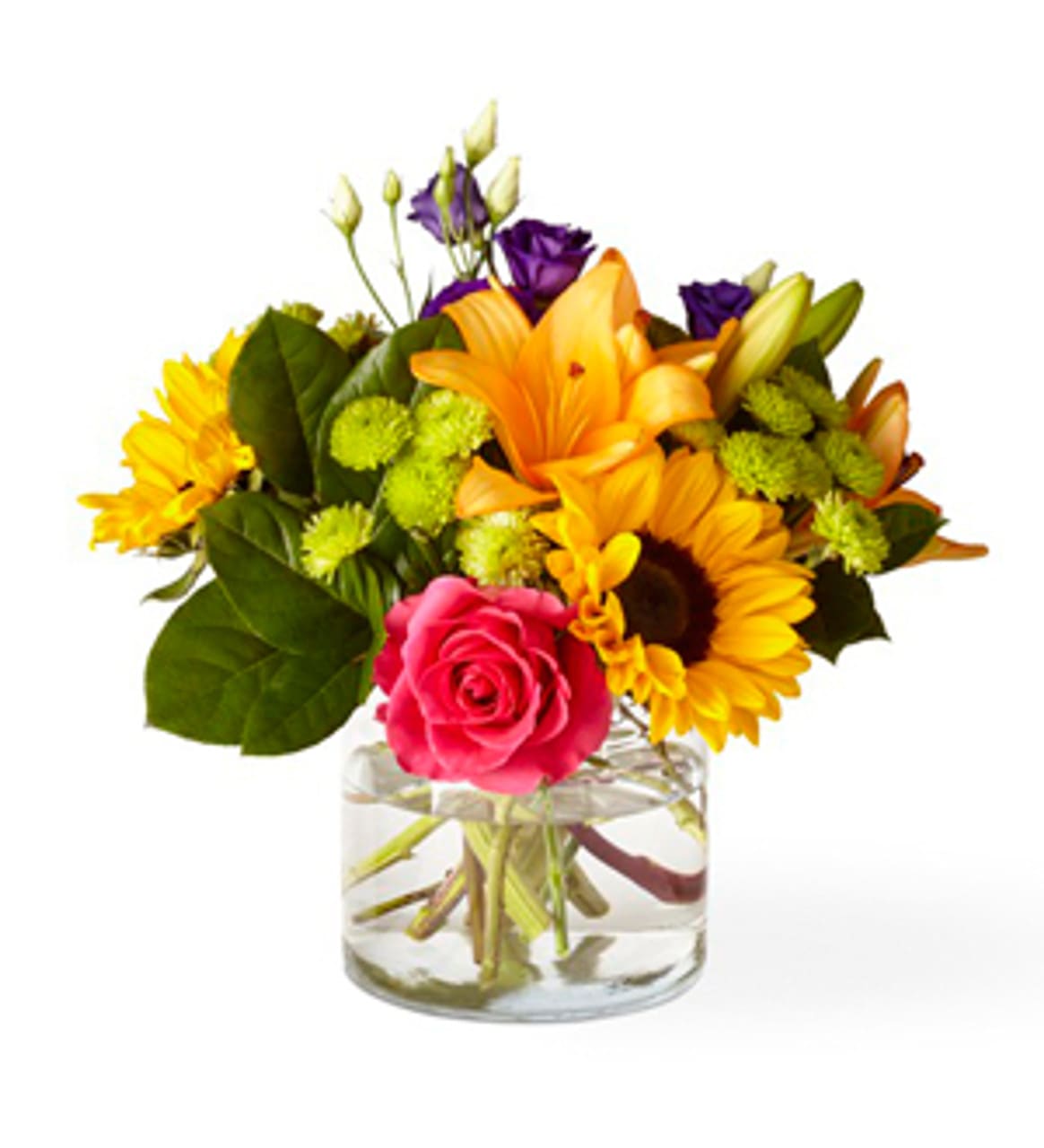 Mixed bouquet of bright flowers in a clear glass vase