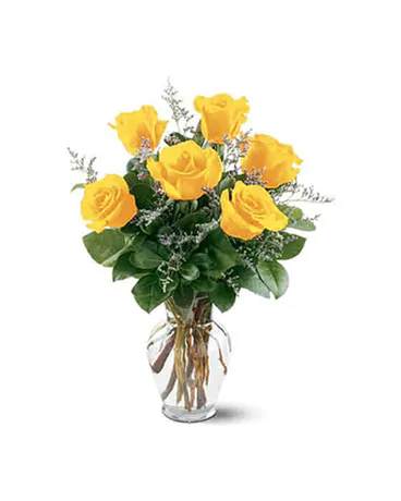 Yellow roses arranged in a clear glass vase