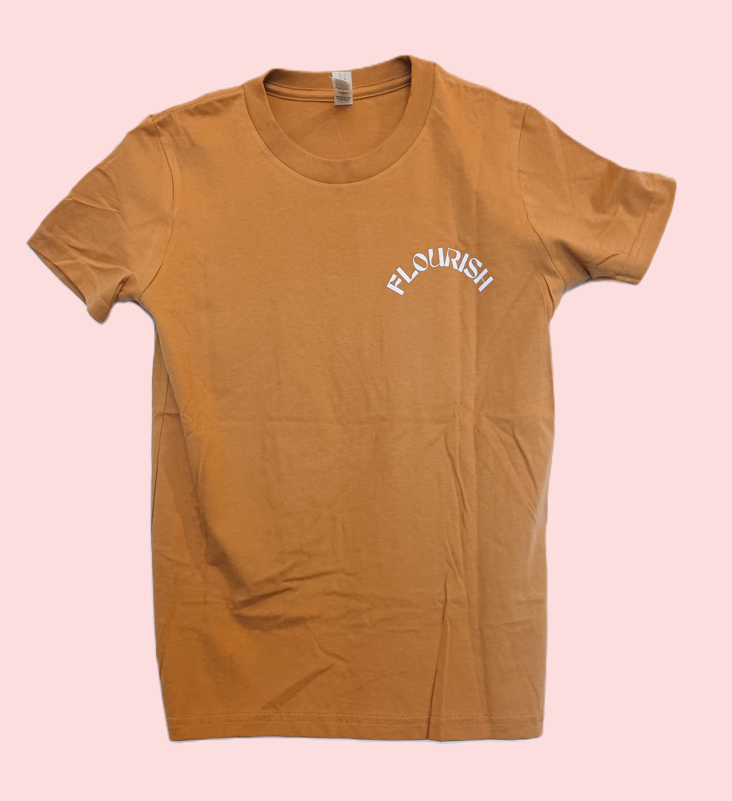 Tan T-shirt with "FLOURISH" printed on the chest