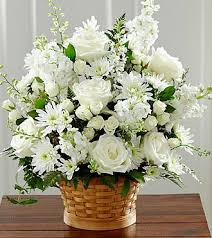 White floral arrangement in a wicker basket