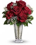Red rose bouquet in a tall silver vase