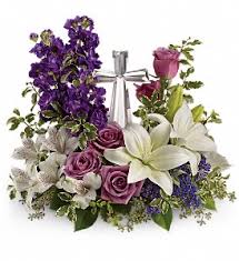 Mixed bouquet with purple flowers, pink roses, and white lilies