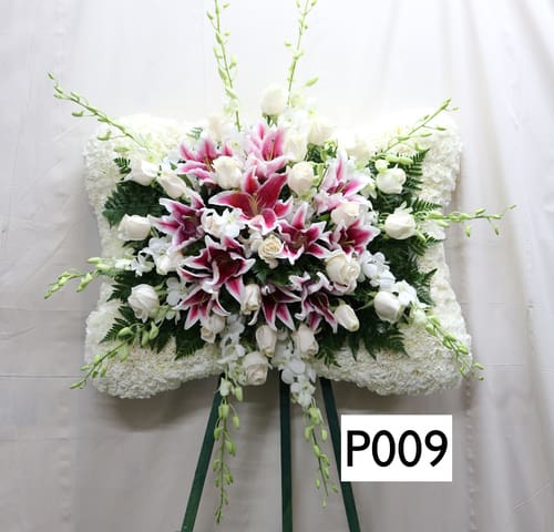 White and pink floral standing spray with lilies and roses