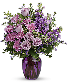 Twilight Bouquet - The perfect pick for the purple lover in your life! This impressive bouquet charms with roses, stock and mums. Presented in a gorgeous glass vase.