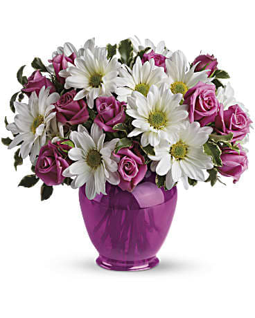 Pink roses and white daisies in a purple vase