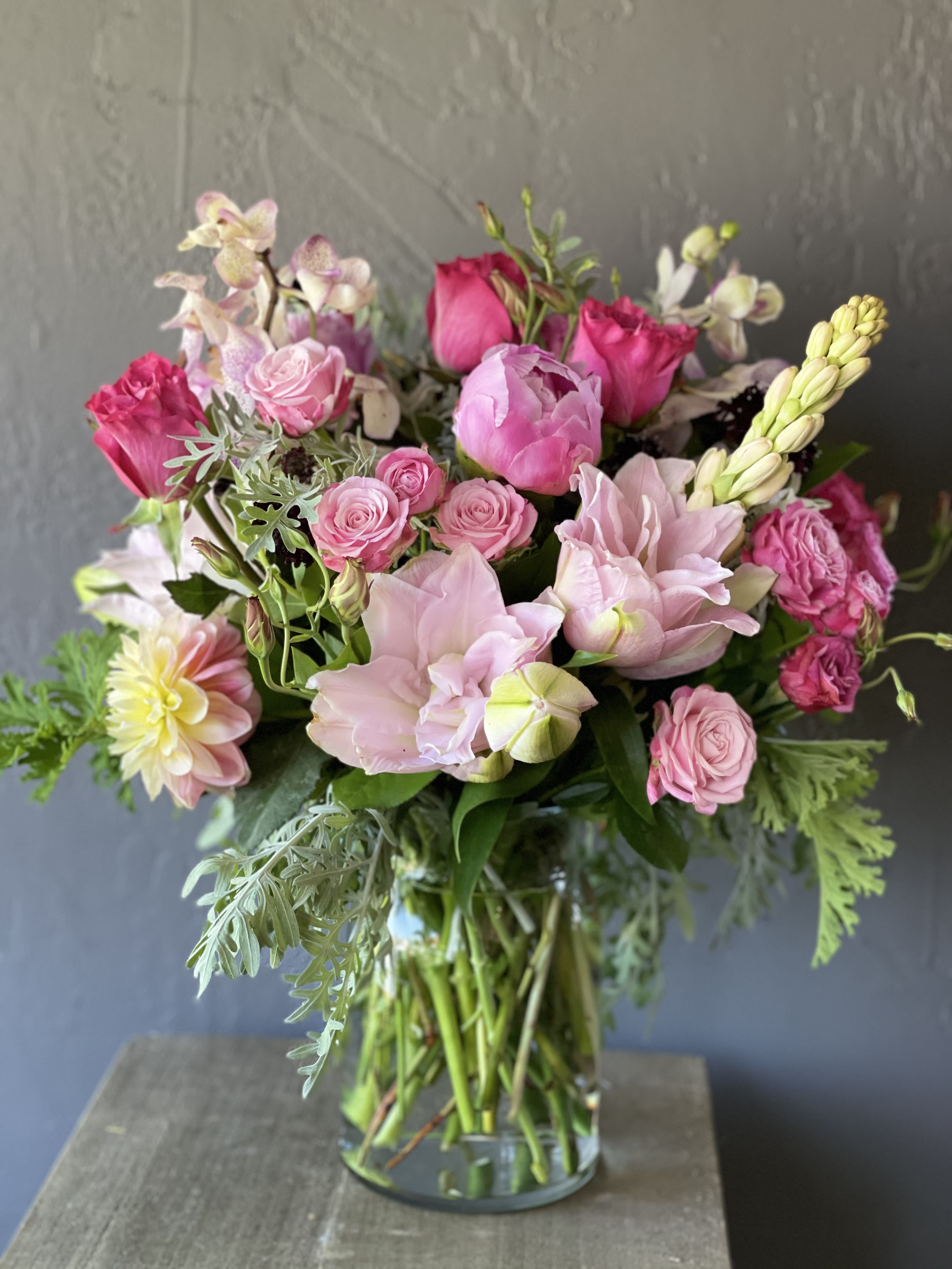 Pink and blush mixed bouquet in a clear glass vase