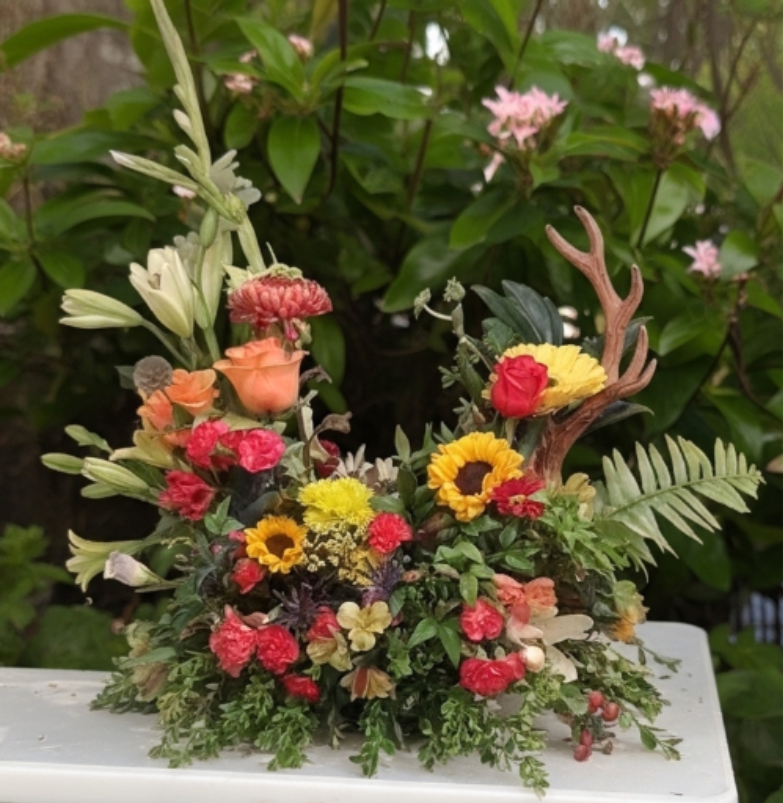 A Hunter's Tribute  - This specialty piece is an ideal table centerpiece for the urn of your loved one. It is a popular as a personalized, masculine sympathy tribute for hunters, fisherman, and passionate outdoorsmen.  *Deluxe Size Shown*
