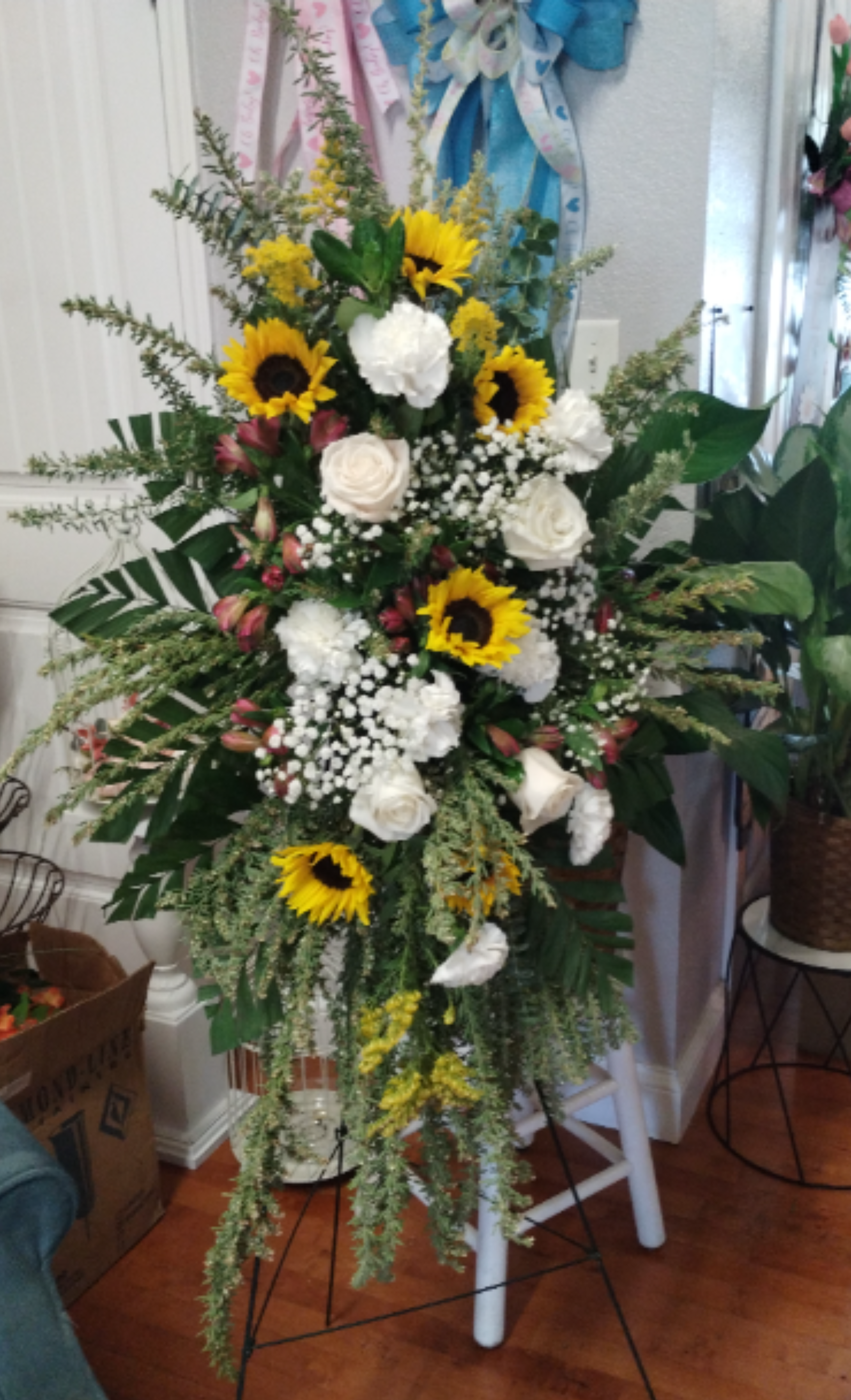 Ray of Sunshine Standing Spray - This is a grand, comforting sympathy tribute designed to bring a sense of warmth, hope, and elegant peace to a memorial service. *Premium Size Shown*