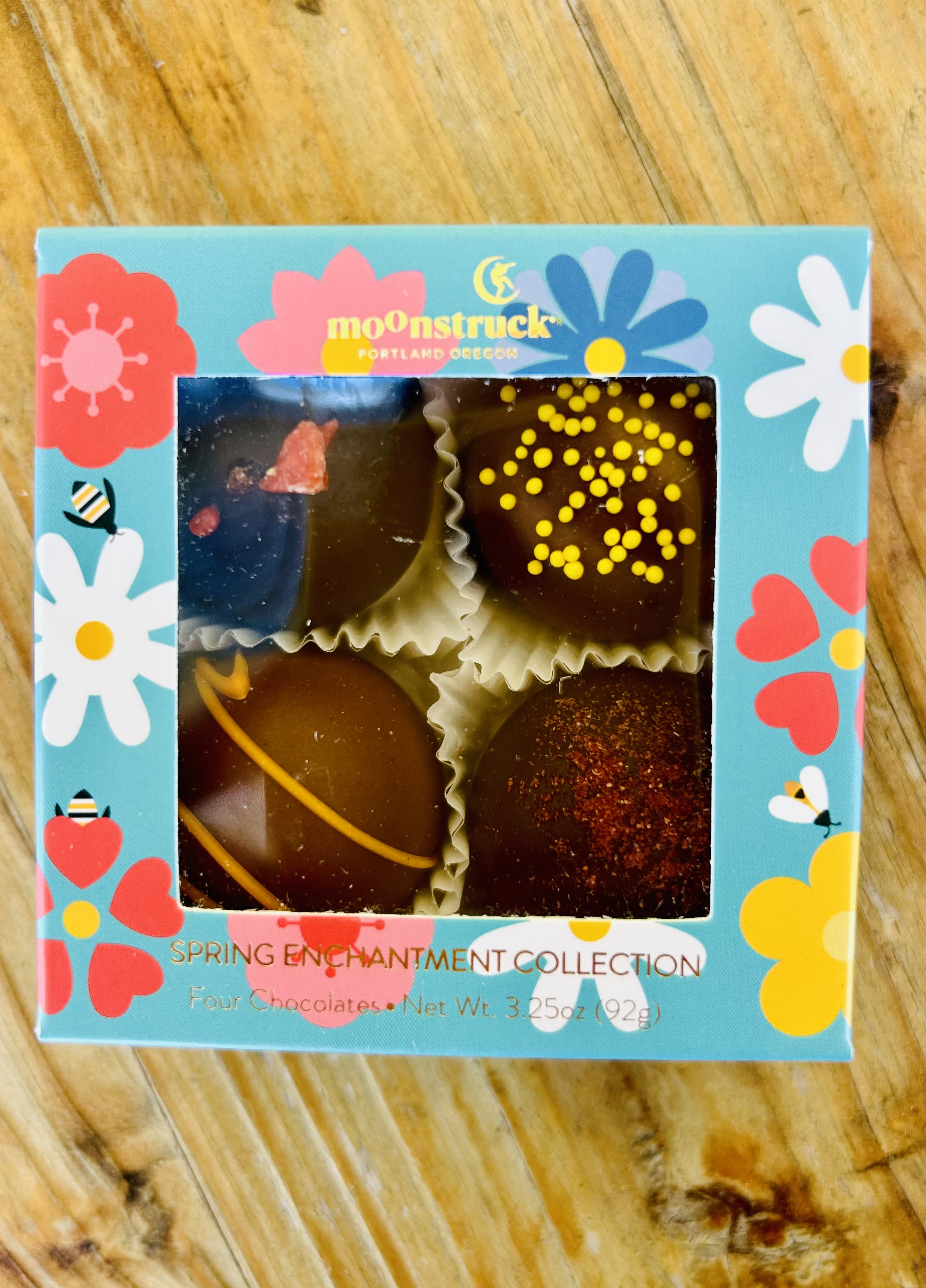 Box of four decorated chocolates in a floral spring-themed package