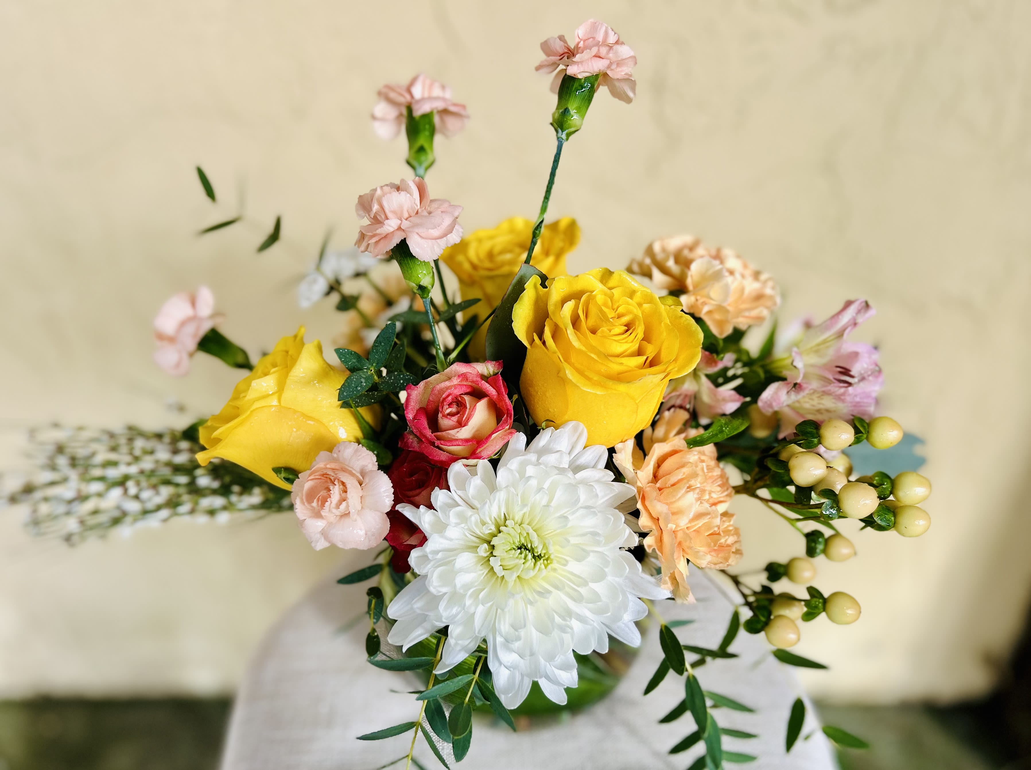 Bouquet of yellow and pink roses with white chrysanthemum and carnations