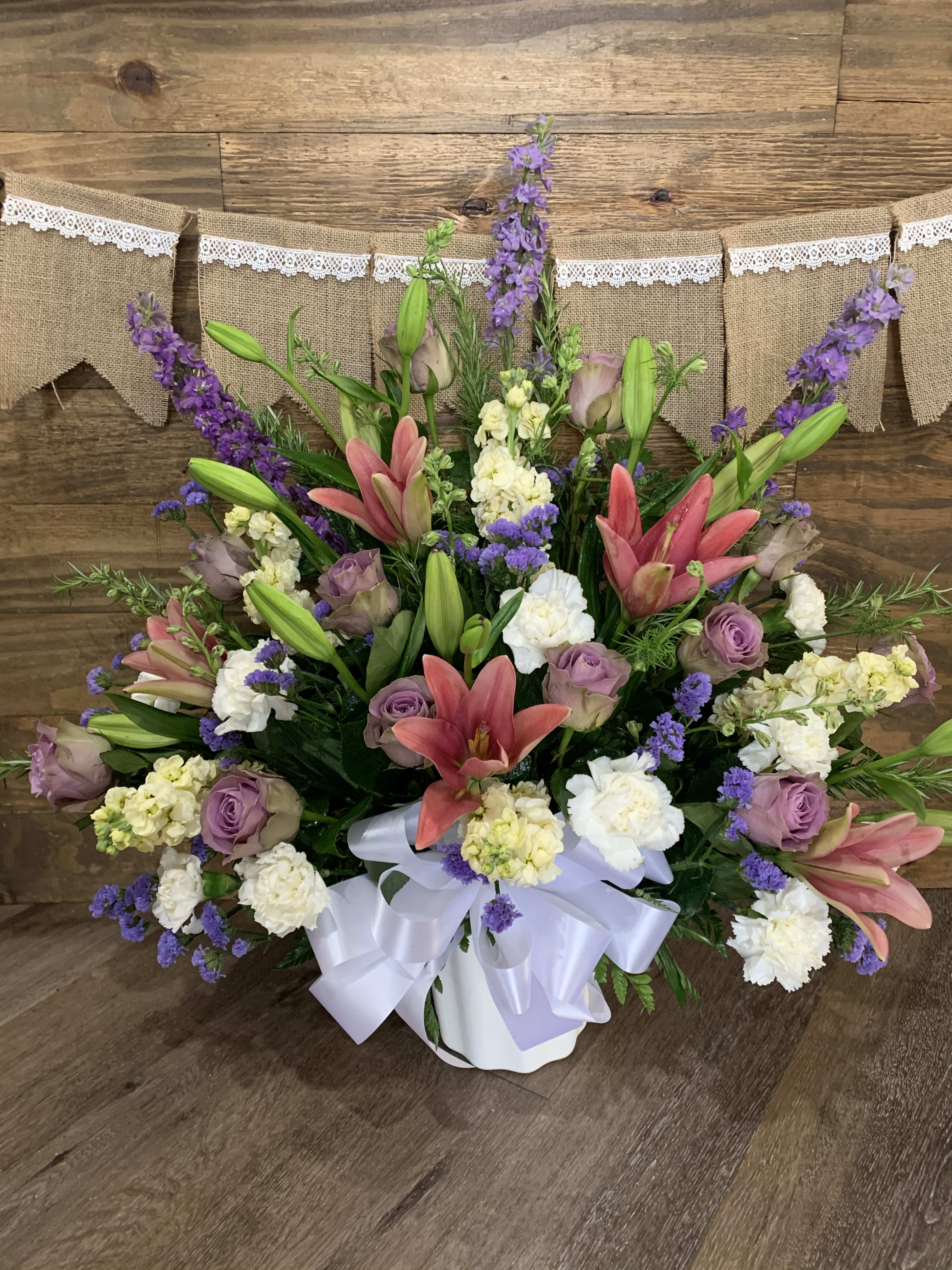 Remember Everyday - Remember them everyday with this beautiful stand up spray done in soothing pastel colors. 