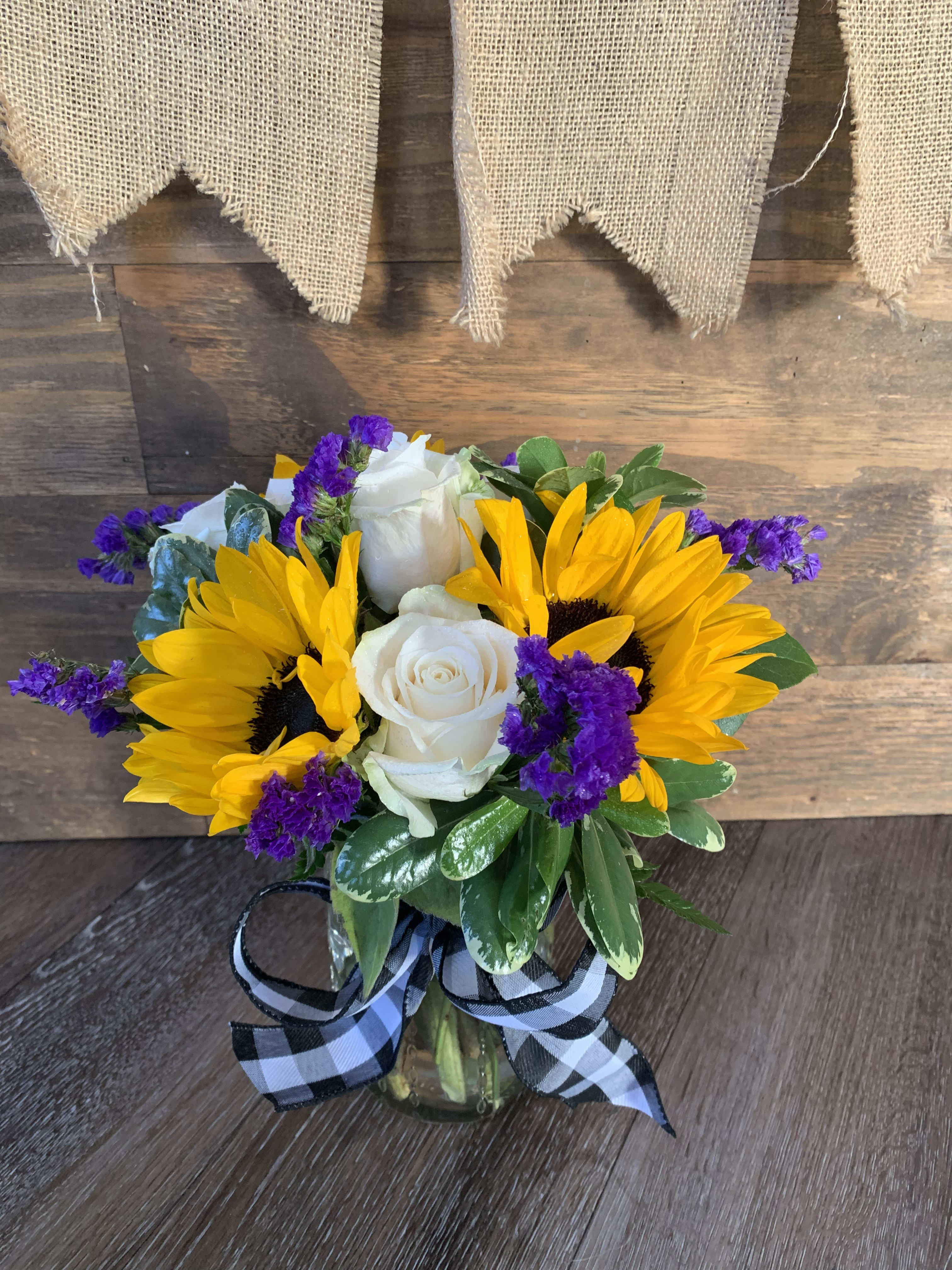 Sunflowers  - Mason jar filled with sunflowers and roses