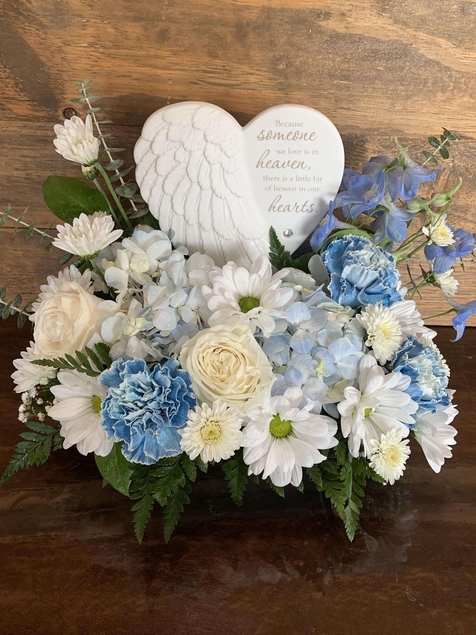 Heavens Heart - Keepsake sympathy plaque displayed in an array of beautiful blue and white blooms.