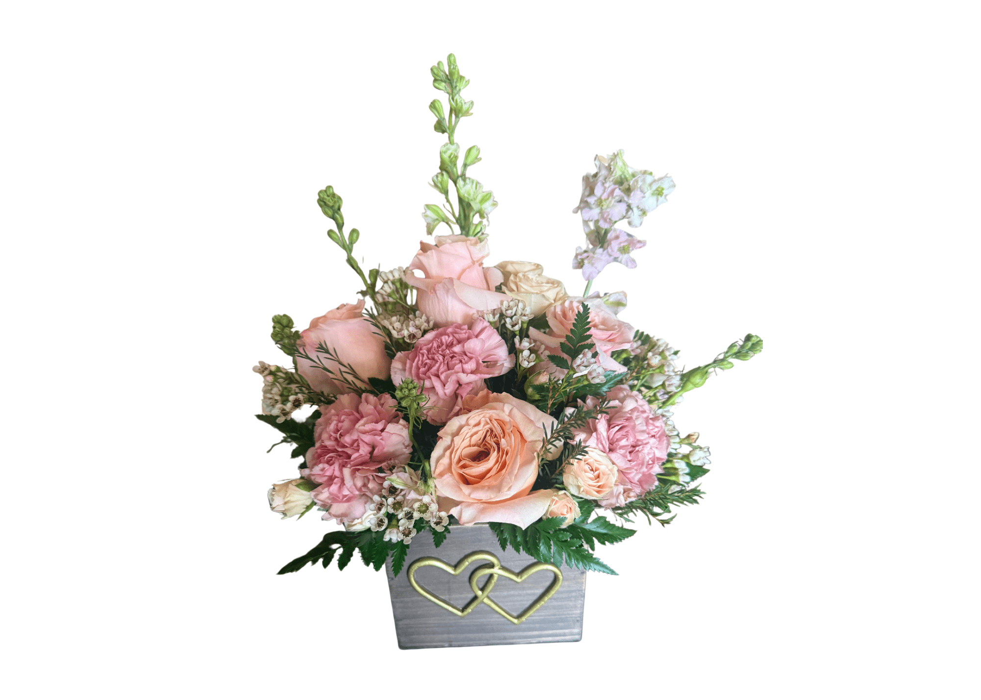 Pink and peach floral arrangement in a gray box with gold hearts