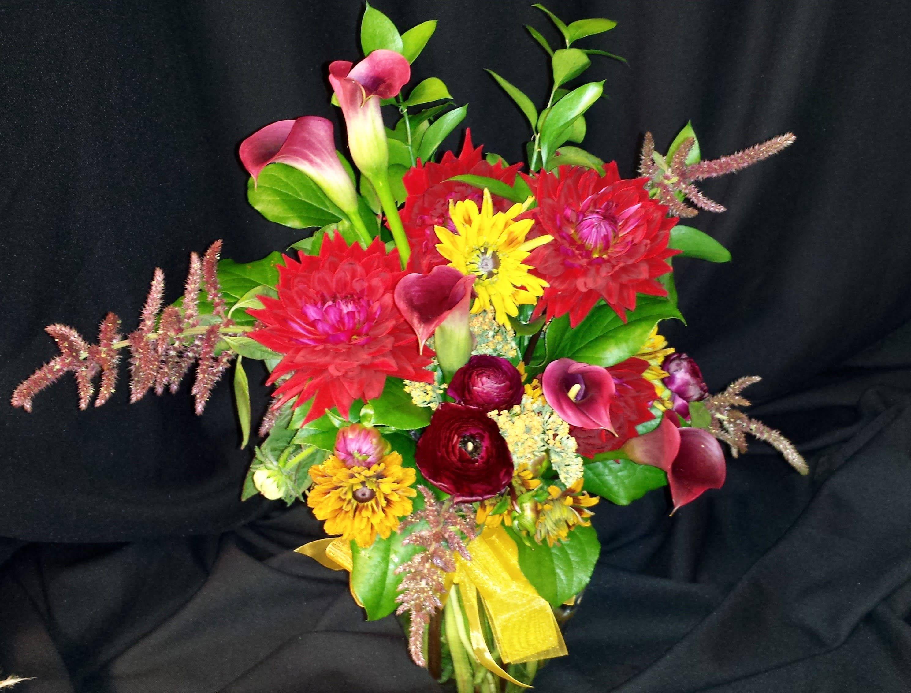 Rich Dahlia Calla Lily Mixed Bouquet - These Premium flowers are plentiful in spring &amp; summer, but order a few days prior for best outcome. We will find a close second if absolutely necessary.  Colors may vary. Let us know if you have favorite colors and we will get them!   Gorgeous vibrant rich color and an all premium assortment in a glass vase. 