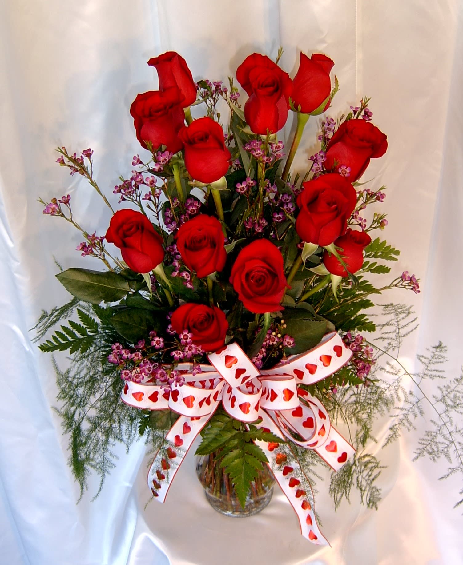 Dozen premium Valentine red roses - Our rose arrangements are so fresh, we don't arrange them until you order them.   If you want the best for your sweetheart, order ahead!