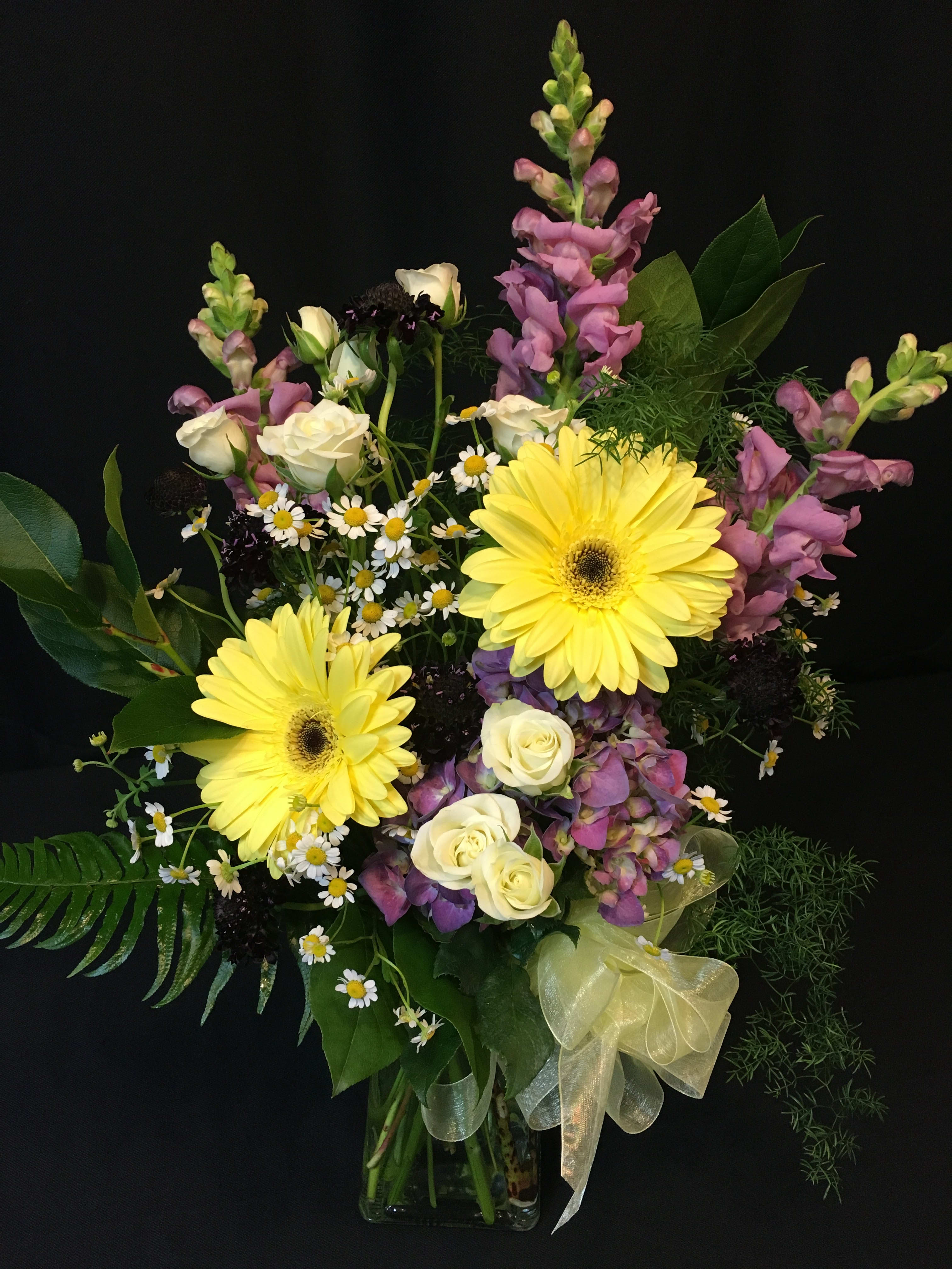 Spray Rose Mixed Spring Bouquet - Depth of color and texture and a playful combination of springy soft flowers.  Each creation at Flower Fiesta is one-of-a-kind so items and colors may vary. Here we have Scabiosa, Feverfew, snapdragon, gerber daisy, hydrangea and spray roses. Fun!   Nice selection for a Get well, a Cheer up, or Just Because.
