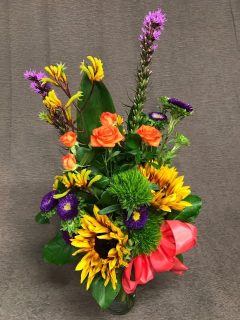 Kangaroo paw bright mix with sunflowers - It's sweet to send a treasured friend or a valued employee a beautiful token of your appreciation.  Large or small, Flower Fiesta will put loving care into your flower arrangement.  Shown here: Bright bold sunflowers, kangaroo paw, liatris and asters make this a delightful combination.* Assortment and colors will vary.  Great choice for a Birthday bouquet
