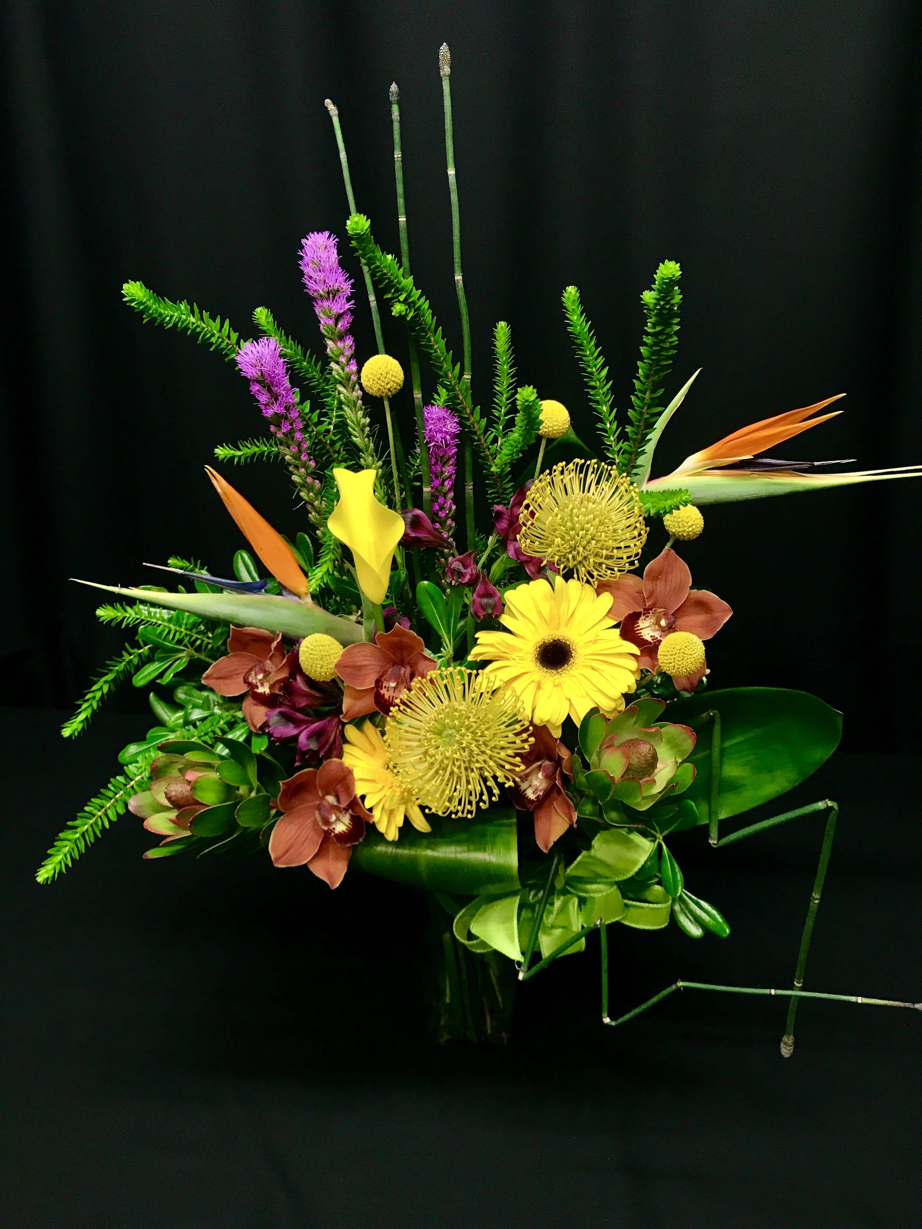 Biggie Bright Exotic - This is a tall one full of bright bold and exotic flowers from all over the world. Assortment WILL vary. Modern architectural design.