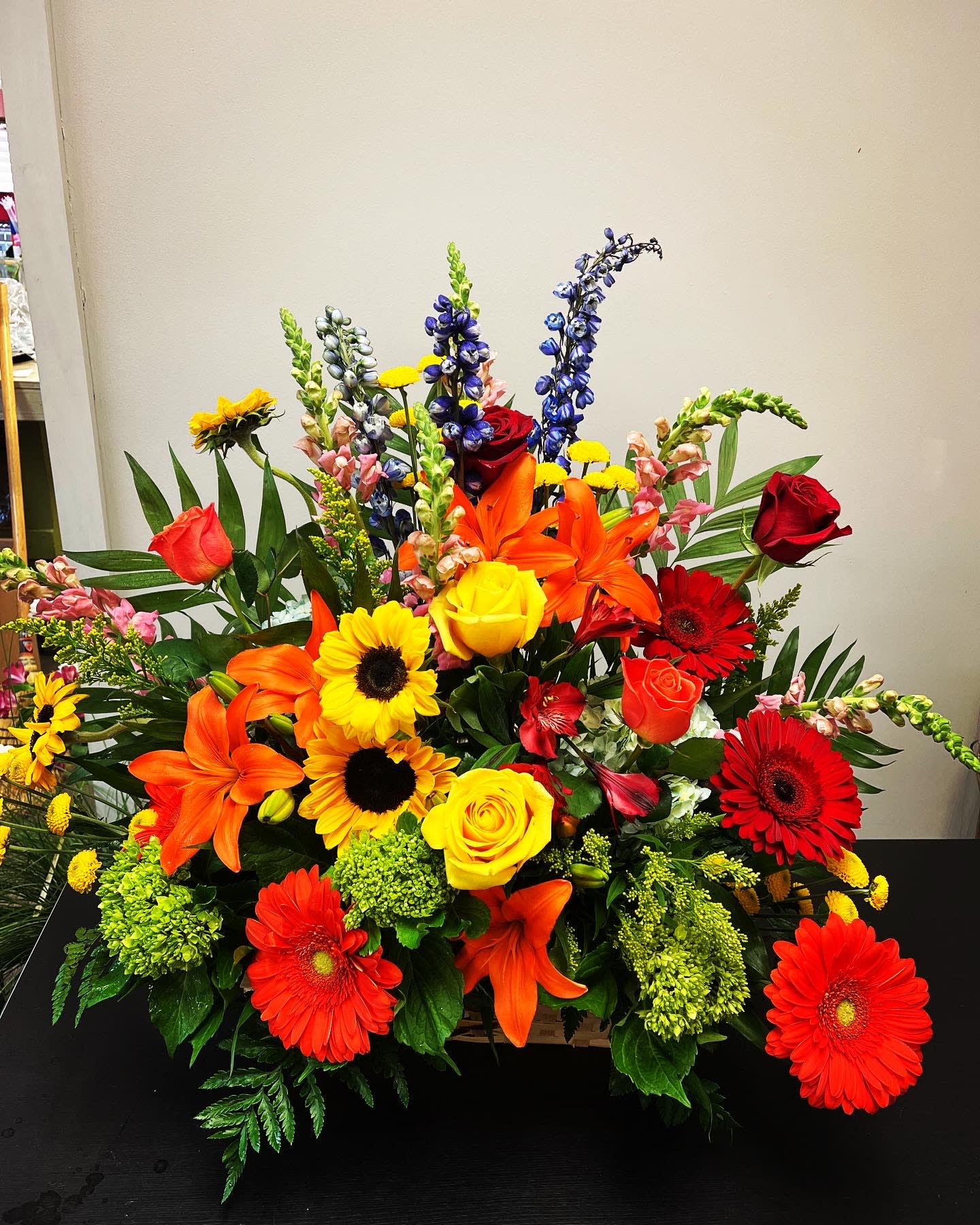 Bright mixed bouquet with roses, lilies, gerbera daisies, and snapdragons