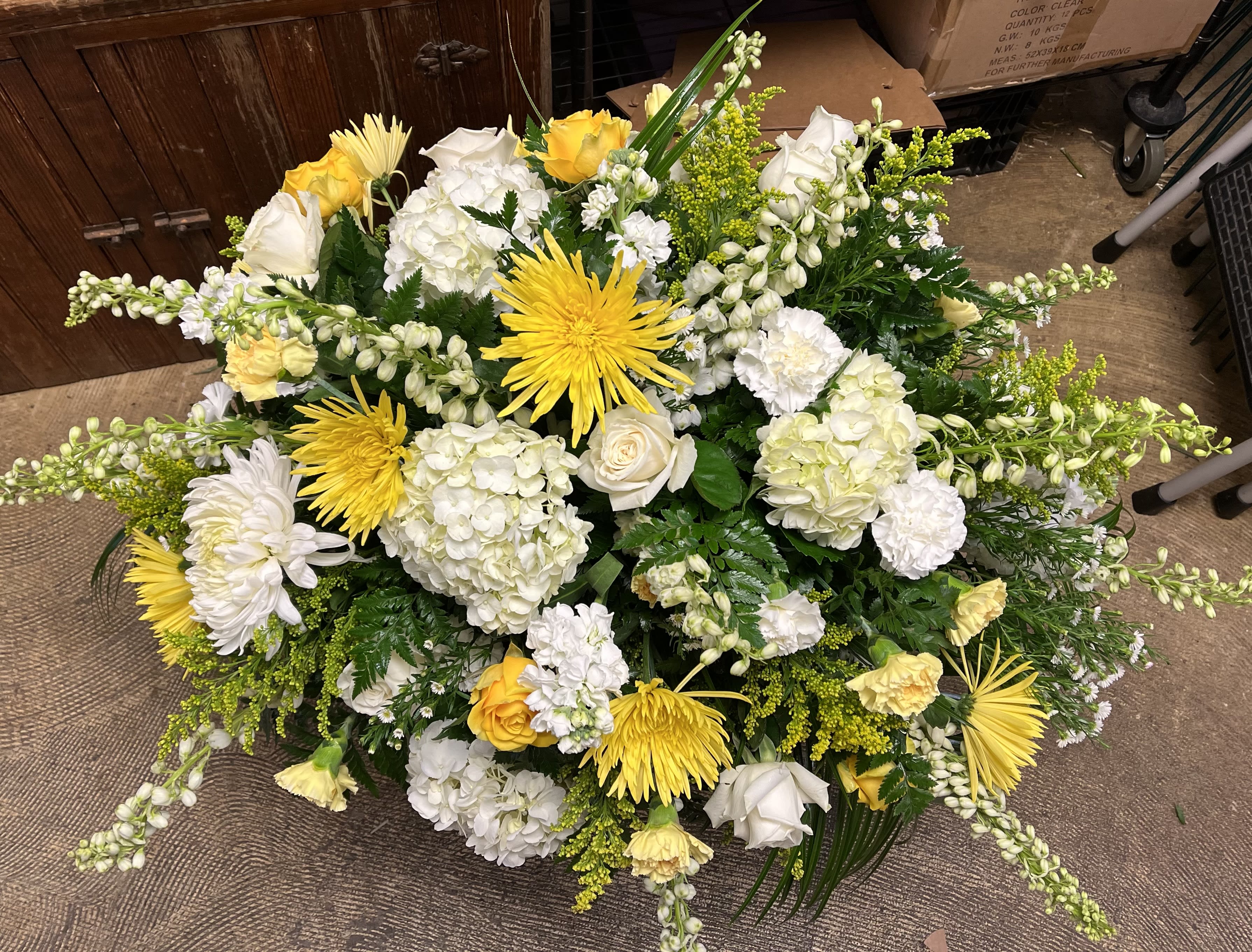 Two tone casket spray ( read description)  - Casket spray with designers choice of flowers. You may choose two colors. Yellow and white, pink, and white, red and white, blue, and white or purple and white. Selection of flowers will vary depending on availability and timing.