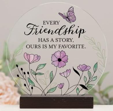 Round friendship plaque with purple flowers and a butterfly on a wooden base