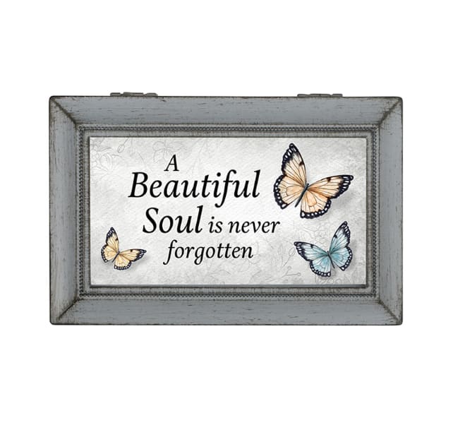 Framed memorial sign with butterflies and the words "A Beautiful Soul is never forgotten"
