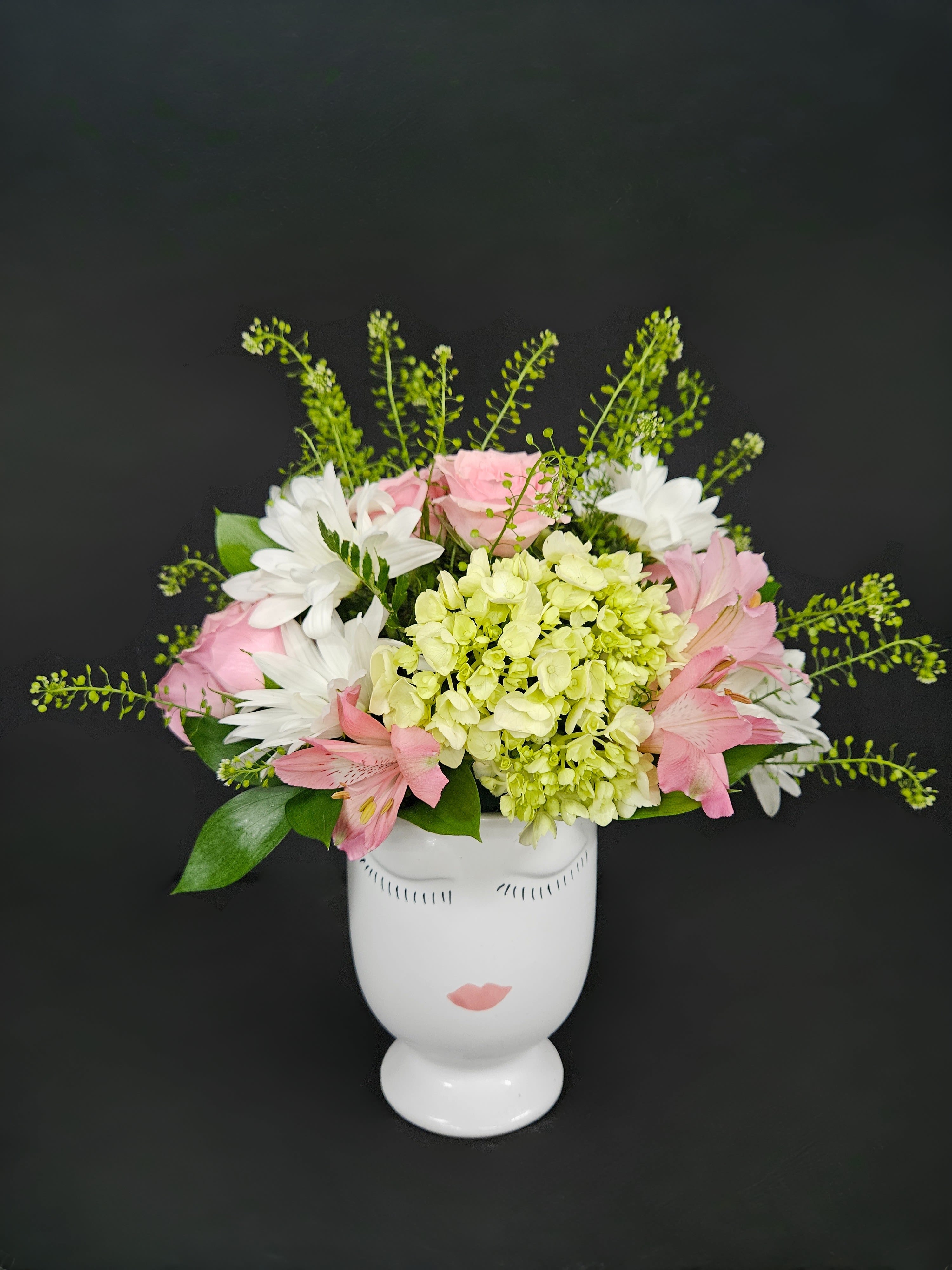 French Kiss (Oh La La!) - All the magic of a romantic night in Paris without the travel! A lovely keepsake vase with elegant pink spray roses, green hydrangeas, white daisies, pink alstro, and pennycress