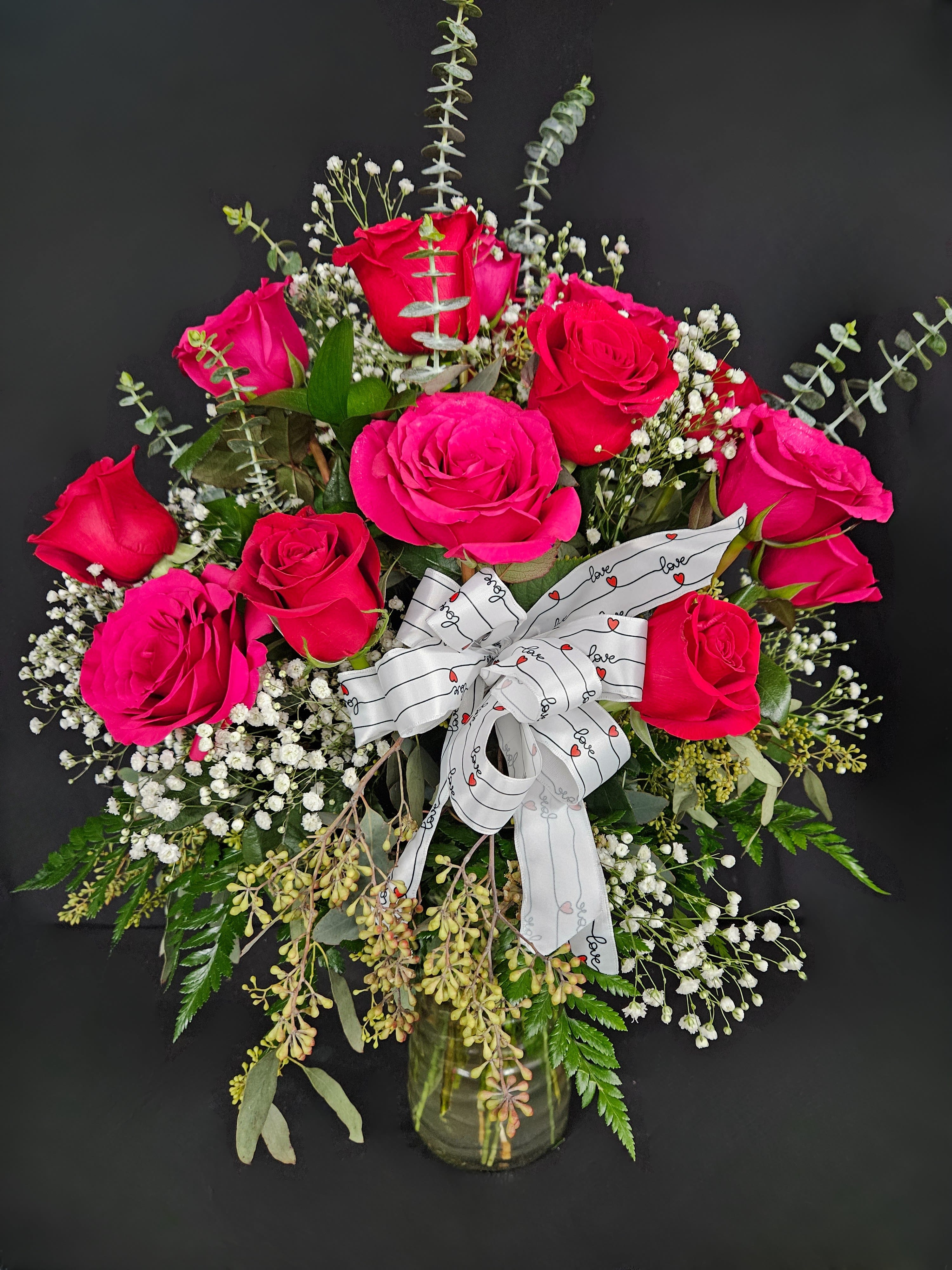 Cherished - 2 Dozen Red &amp; Hot Pink Roses - Express your love for the number one in your life with this beautiful arrangement of two dozen red and hot pink roses artfully arranged with baby's breath and decorative greens.