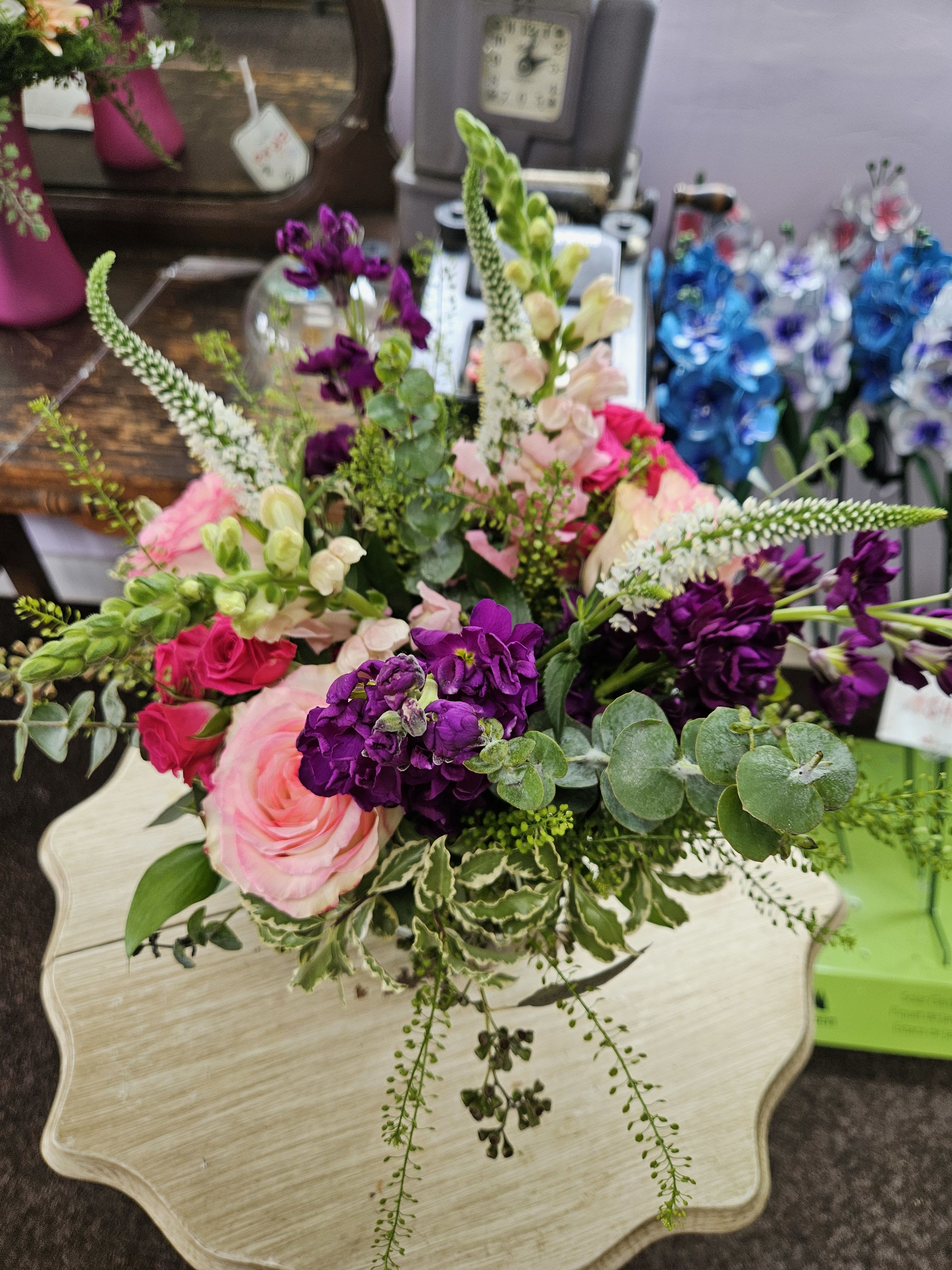 Esperanza Summer Pink Cylinder Vase - Vibrant pink mix featuring Esperanza roses and mix of other pink specialty flowers in a cylinder vase.
