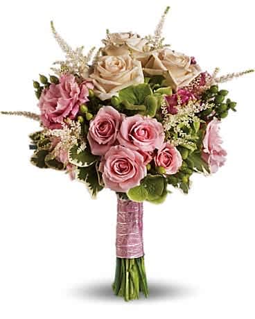 Bouquet of pink and cream roses with greenery and a pink wrapped handle