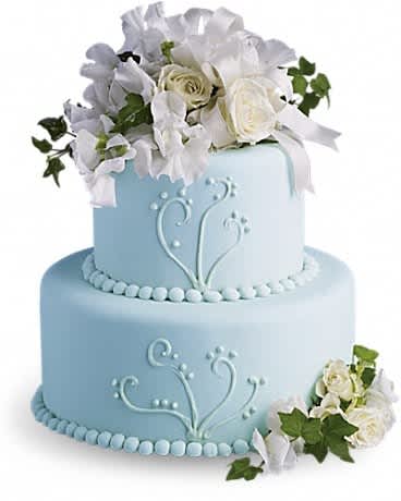 Two-tier blue cake with white floral decorations and roses