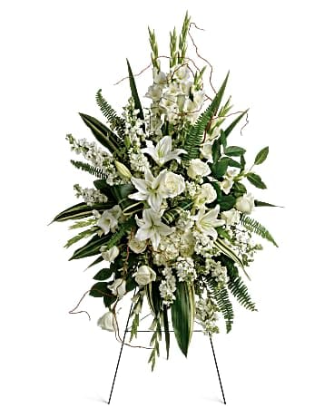 White floral standing spray on an easel