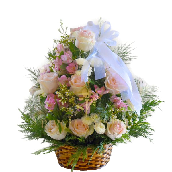 Sympathy Basket - In the somber embrace of loss, the funeral basket stands as a heartfelt tribute, a delicate composition of sympathy and solace. Adorned with a tapestry of fresh blooms, each petal whispers a story of remembrance and love. Soft hues of pink white and gentle pastels convey a sense of peace and serenity offering comfort to those who mourn.This extremely elegant basket of roses is just perfect to honor and celebrate the life of a loved one .Created with  premium roses, seasonal flowers and foliage ,this basket says it all .For same day delivery and Free Delivery Options Text or Call  832-973-1376.  