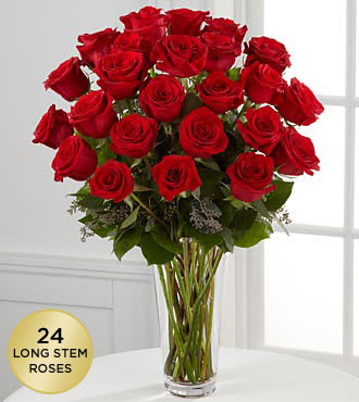 Bouquet of red roses in a clear glass vase