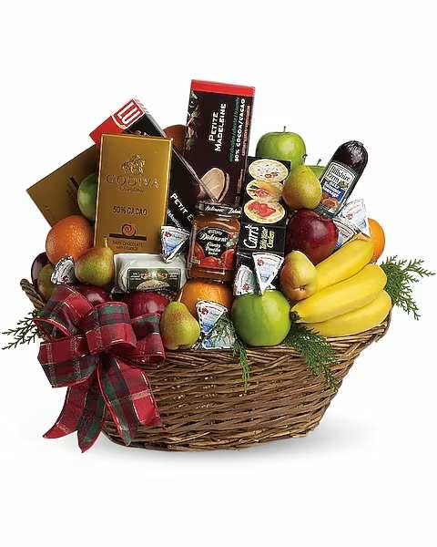 Gift basket with fruit, chocolates, and a plaid ribbon