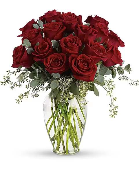 Bouquet of red roses in a clear glass vase