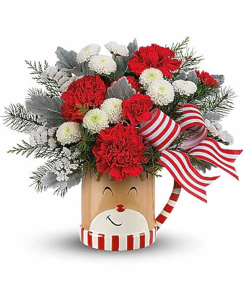 Red and white floral arrangement in a reindeer-themed container with striped ribbon
