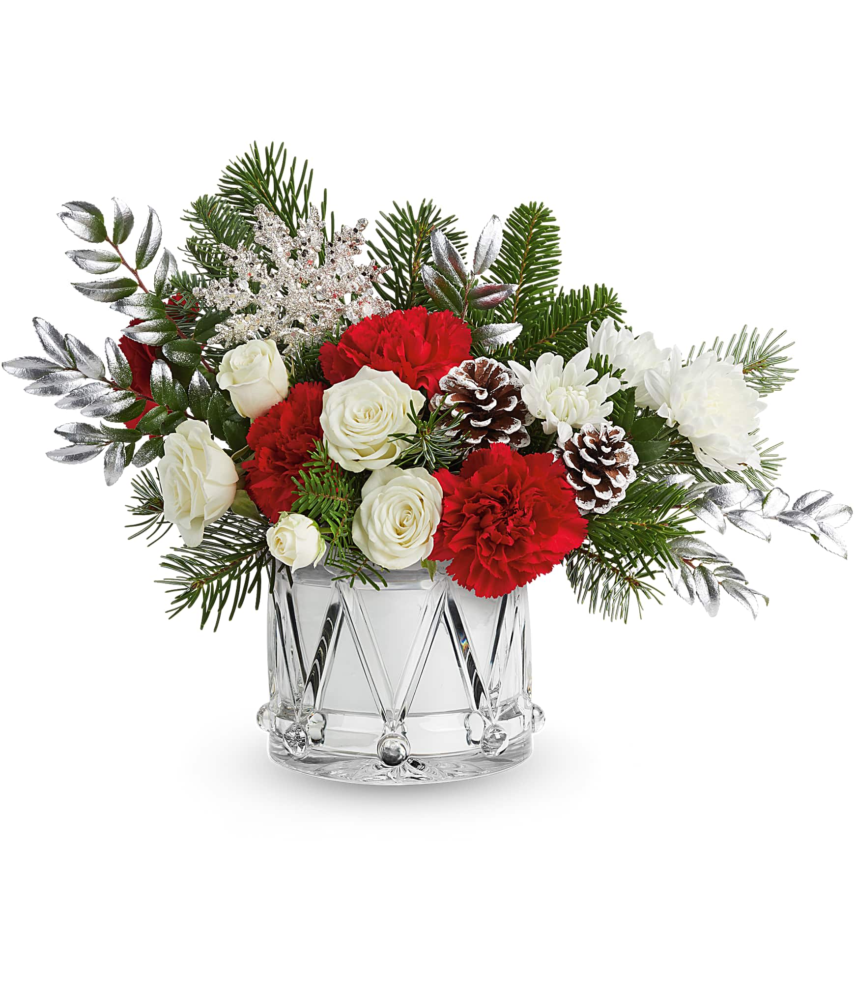 Red and white floral arrangement in a clear glass vase with pinecones