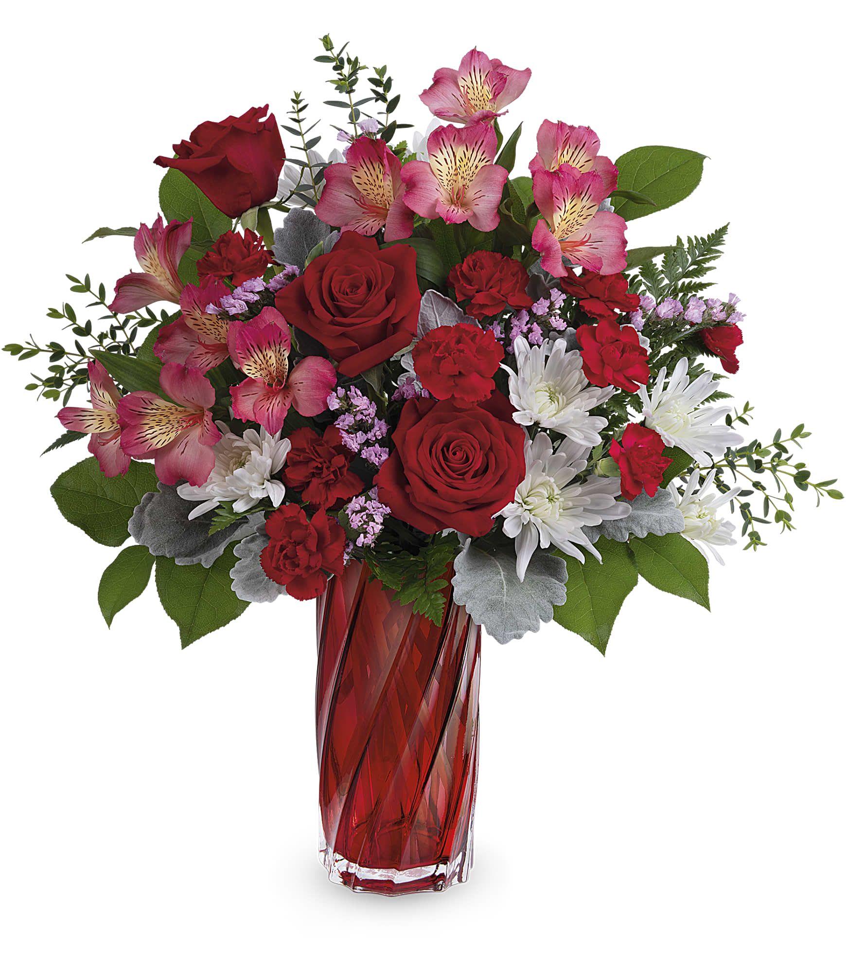 Red roses and pink alstroemeria in a red glass vase
