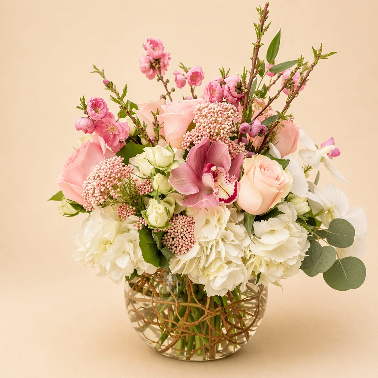Touch of Rosa - Mixture of roses, orchids, hydrangeas, greenery, spray roses, and more.