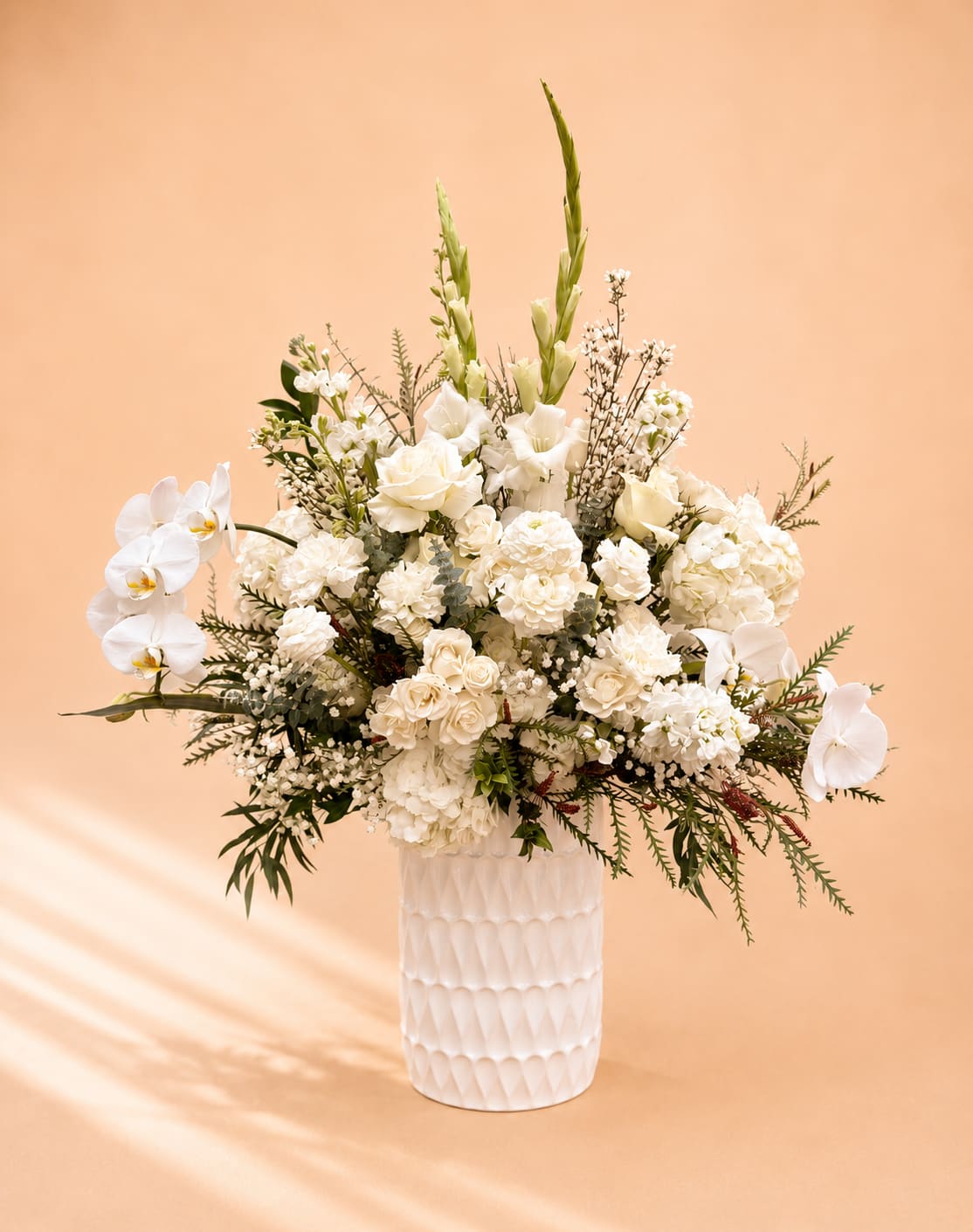 White Mist - All white florals which includes white roses, white spray roses, white orchids, white ranunculus, babysbreath, white hydrangea, and more