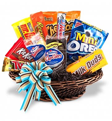 Basket of assorted candy bars with a striped ribbon bow