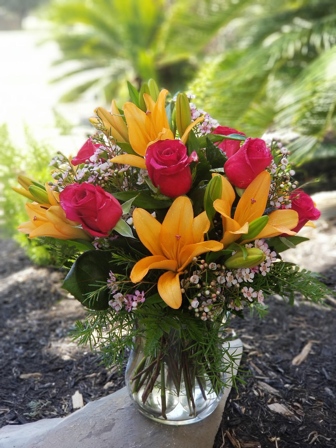 Fiesta Lily and Rose - Spark someone's attention by sending this absolutely radiant bouquet. Full of flowers and fiery beauty, it makes a beautiful gift for any occasion.