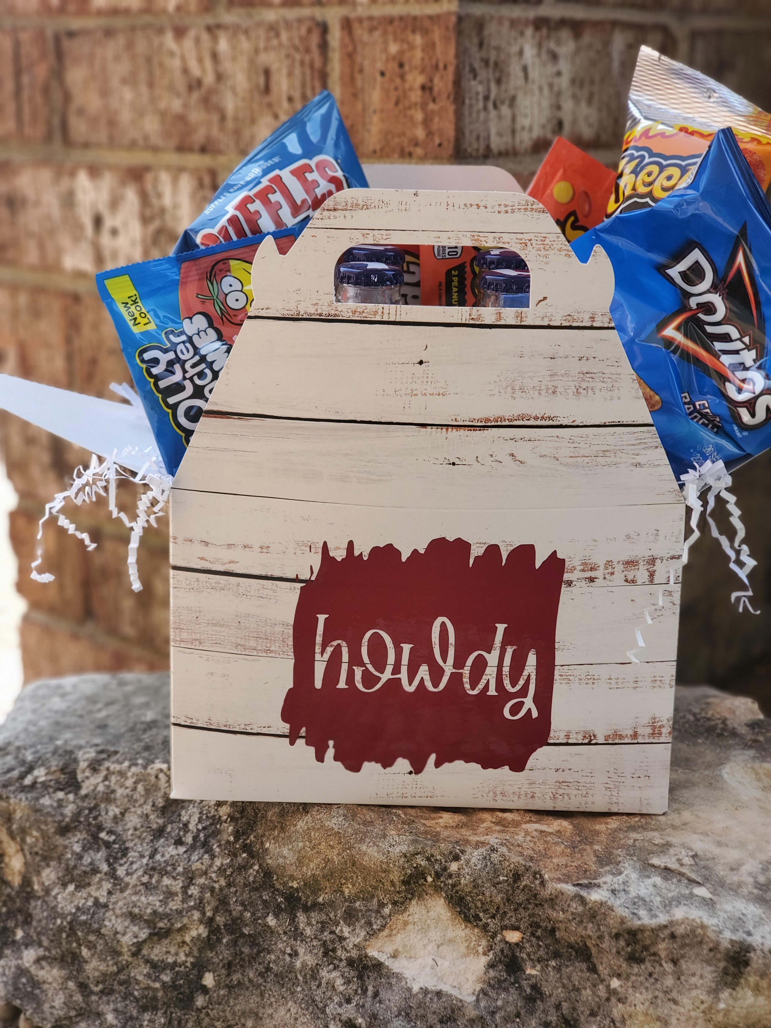 Wooden gift box with assorted snack bags and candy