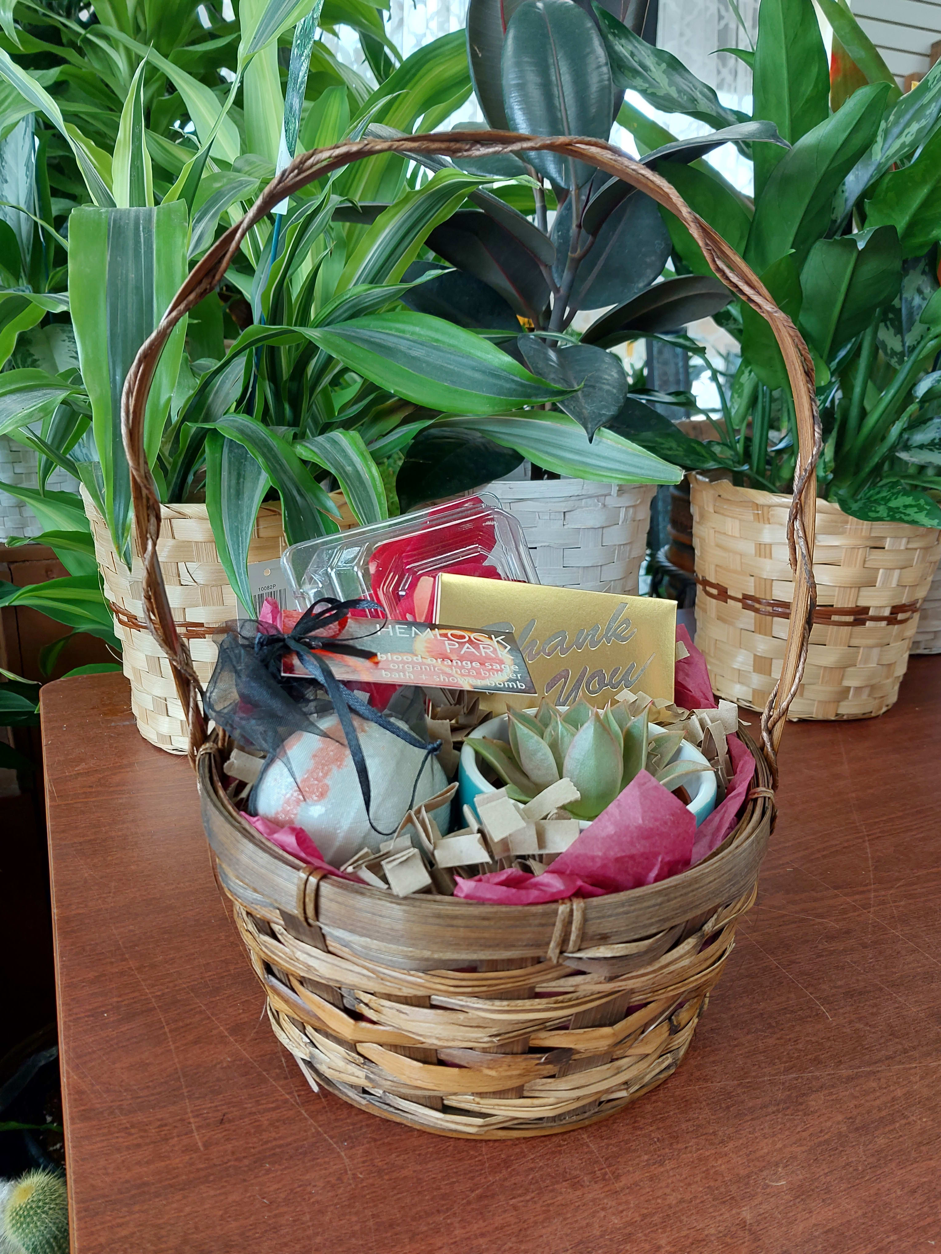 Gift basket with a succulent, bath items, and a thank-you card