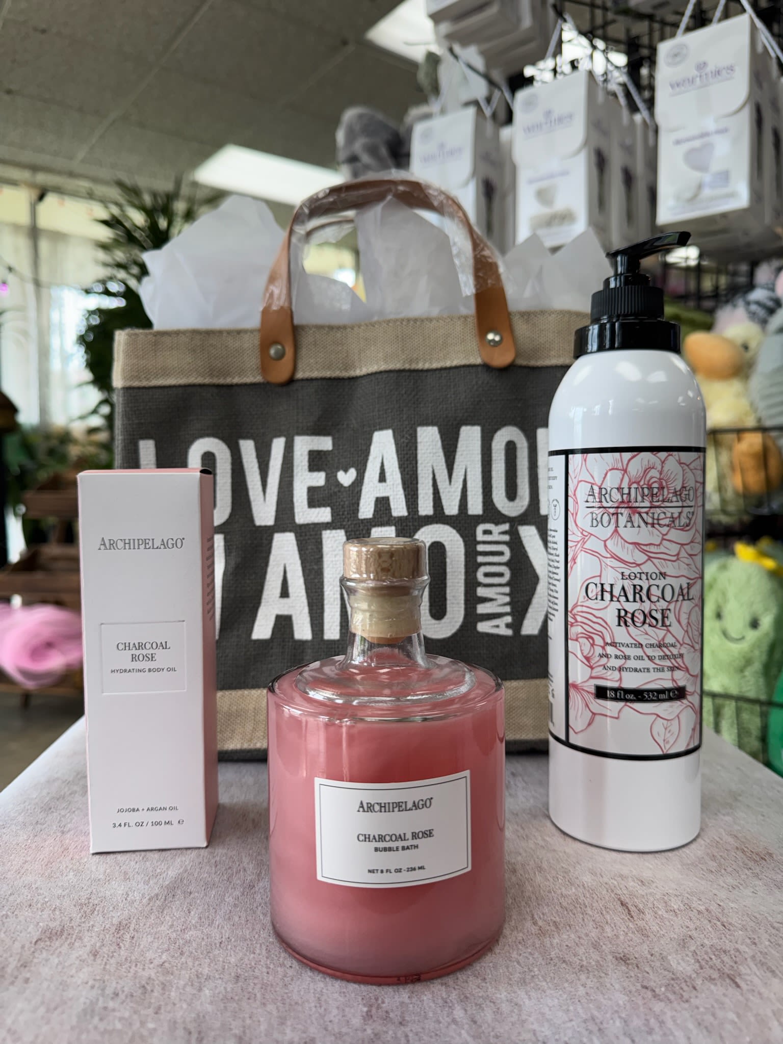 Archipelago Rose Garden Retreat Collection - A luxurious escape designed to restore, relax, and indulge the senses this Mother’s Day.  The Rose Garden Retreat collection features a curated trio of Charcoal Rose bath and body essentials, blending floral elegance with a modern, sophisticated edge. Infused with notes of charcoal, black cassis, and pressed rose, each product is designed to nourish the skin while creating a calming, spa-like experience at home.  This collection includes Charcoal Rose Body Lotion, enriched with activated charcoal and rose extracts to hydrate and soften the skin. The Charcoal Rose Hydrating Body Oil is a 100 percent natural blend of jojoba, argan, and rosehip oils that delivers deep moisture while supporting smooth, radiant skin. Completing the set is the Charcoal Rose Bubble Bath, designed to gently detoxify while creating a relaxing and restorative soak.  Thoughtfully designed for Mother’s Day, this collection is a beautiful way to give the gift of rest, renewal, and everyday luxury.