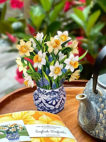 Pop-up bouquet of daffodils in a patterned vase