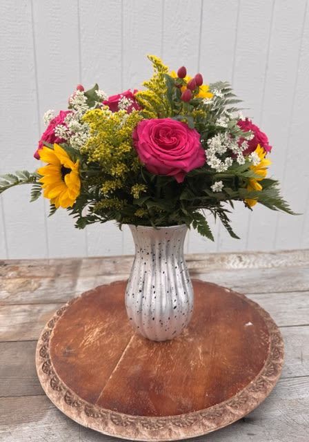 Sunshine &amp; Love Bouquet - Sunshine and Love Bouquet  A radiant arrangement filled with warmth, joy, and the kind of love that brightens every day.  Sunshine and Love Bouquet features cheerful sunflowers paired with roses, hypericum, solidago, and Queen Anne’s lace. The combination of bright, uplifting tones and soft, airy accents creates a design that feels both vibrant and naturally elegant.  Each bouquet is thoughtfully arranged to bring light and happiness into any space, making it a beautiful expression of appreciation and care.  Designed with Mother’s Day in mind, this arrangement is a meaningful way to celebrate her with something as bright and uplifting as the love she shares.