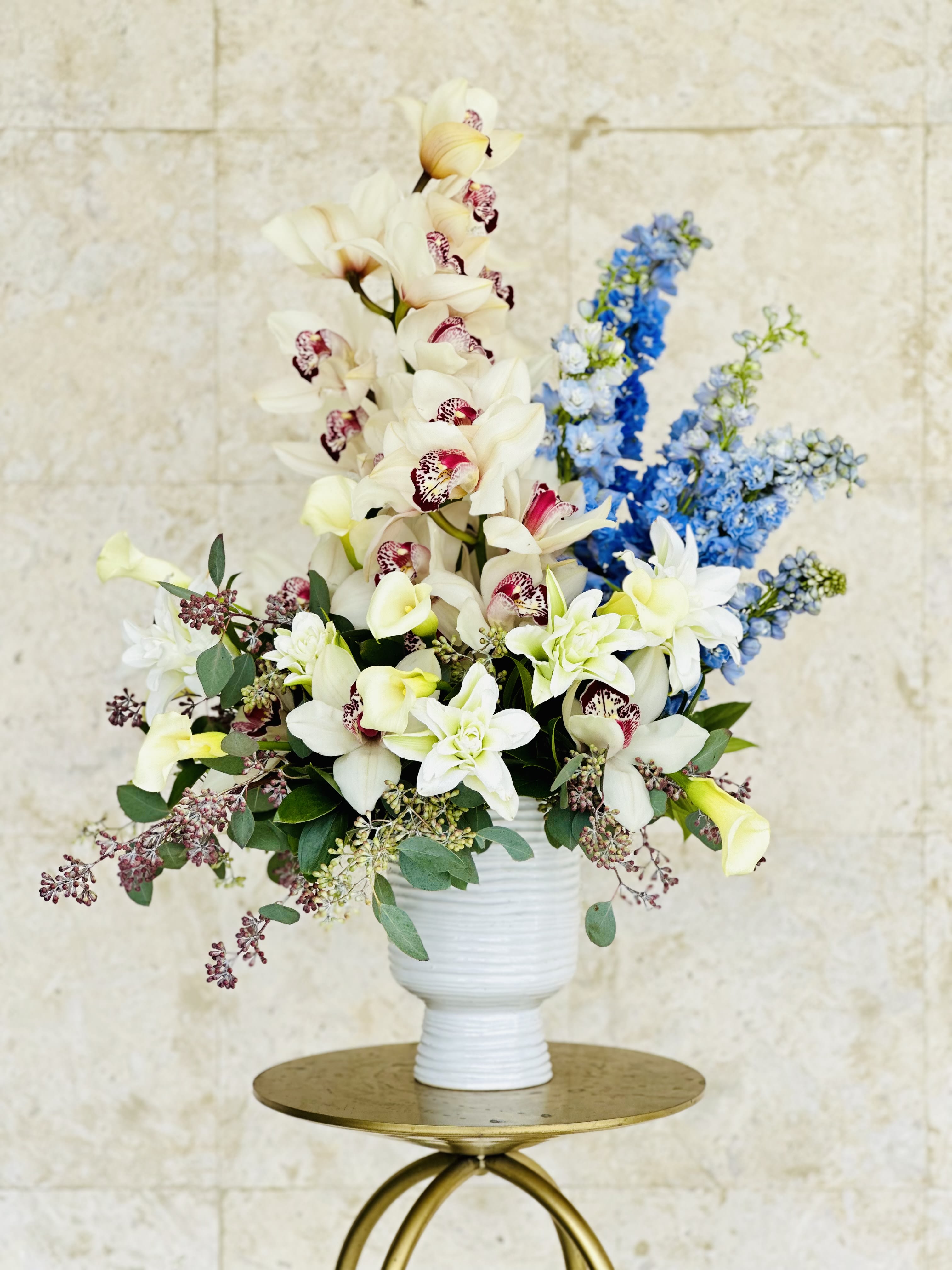 Lovely Whites - There's nothing quite like a beautiful flower arrangement to bring a festive cheer to your home!  For Hanukkah, why not try a classic white flower arrangement? Filled with premium blooms.